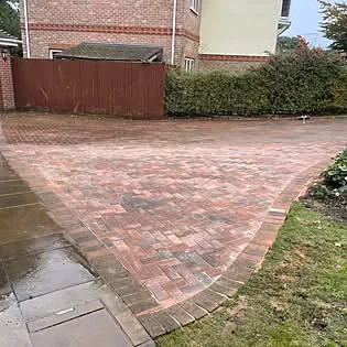 Freshly finished block paving driveway, wet surface